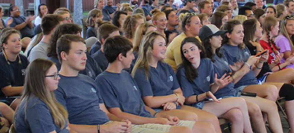 Group of students sitting at a facility