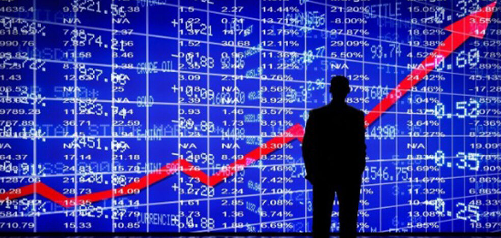 Man standing in front of a stock chart